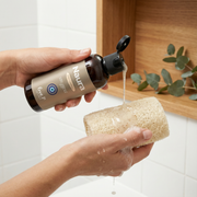 Naura body care bottle placed in a simple product display